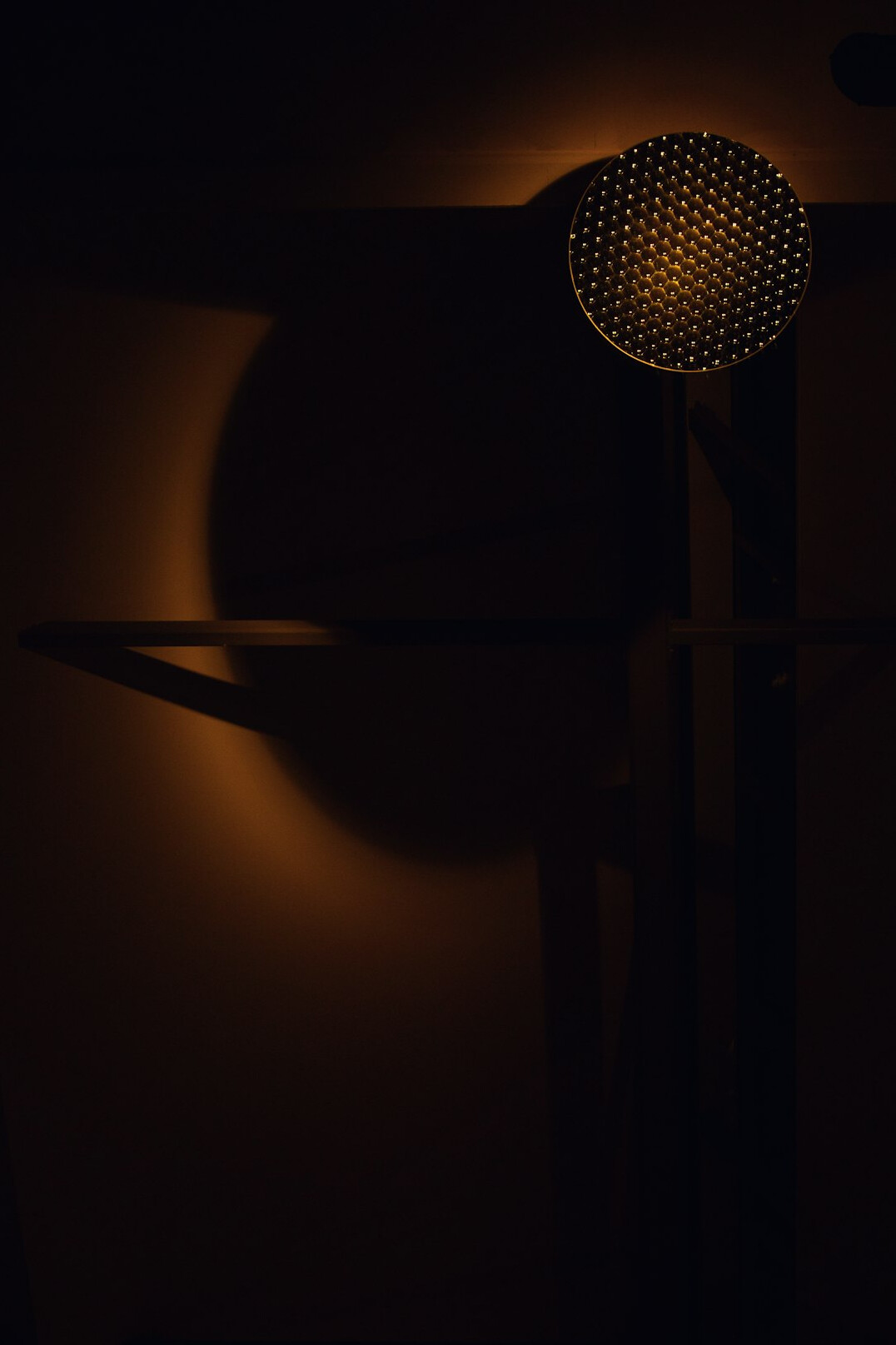 Close-up of a studio microphone in warm light