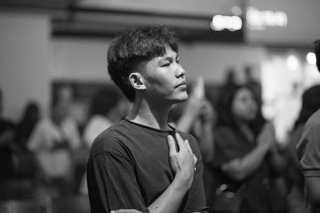Person practicing conscious breathing with hand on chest
